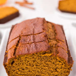 loaf of pumpkin bread cut open to see inside