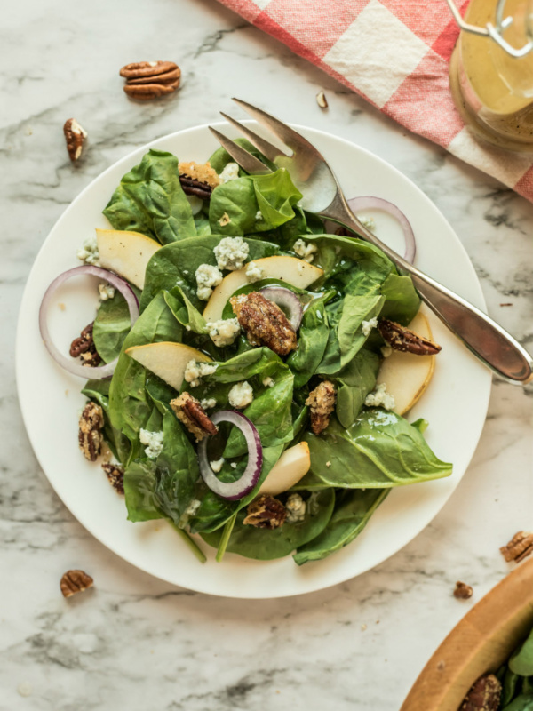 autumn salad on white plate with fork