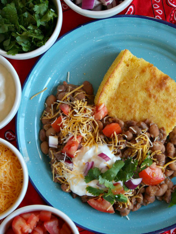 beans and cornbread in a blue bowl