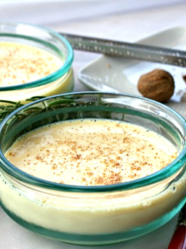 eggnog custard with nutmeg in glass dish