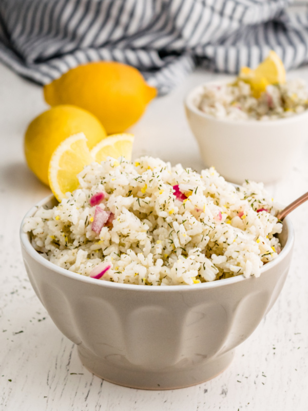 lemon dill rice in a bowl with lemons