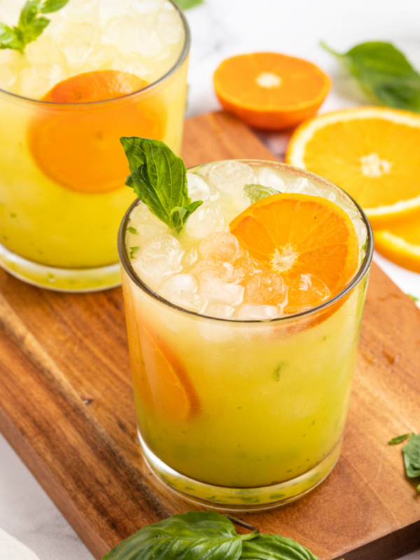 orange basil mojitos in two glasses