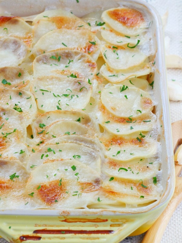 scalloped garlic potatoes in a casserole dish