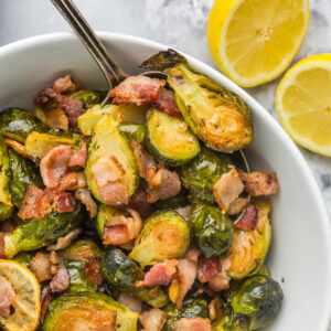 bowl of roasted brussels sprouts with lemon and bacon