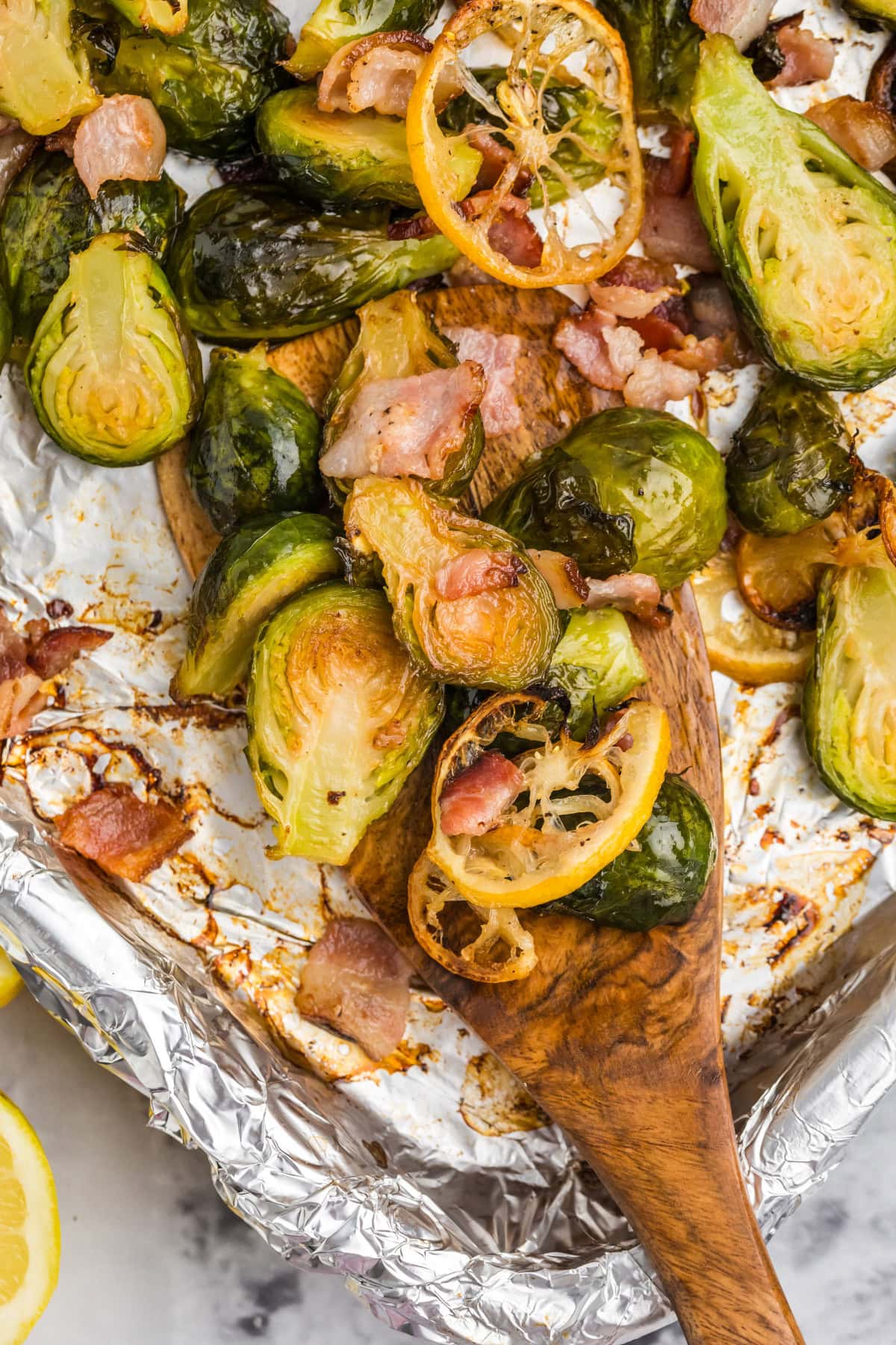 Sheet pan of roasted brussels sprouts with lemon and bacon