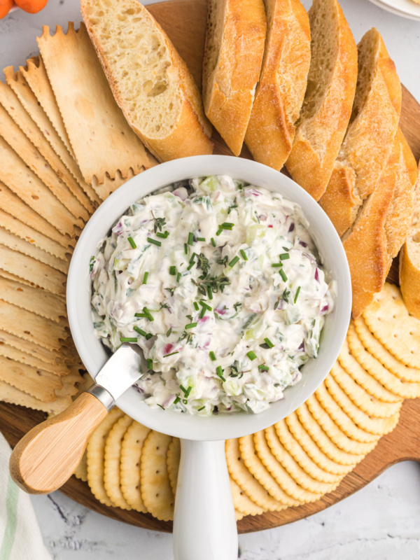 vegetable goat cheese spread in bowl with crackers