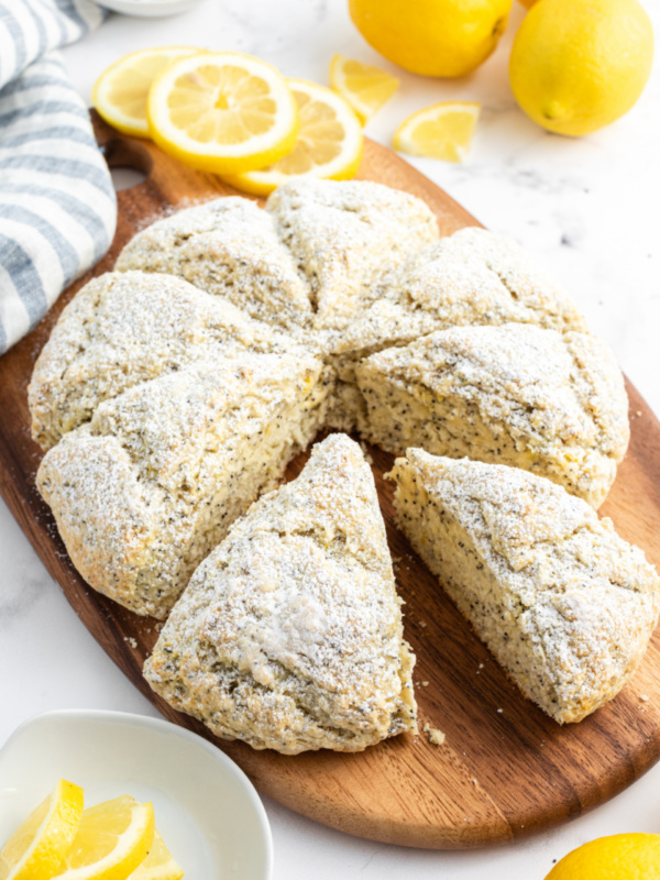 lemon poppyseed scones on a board pulled apart