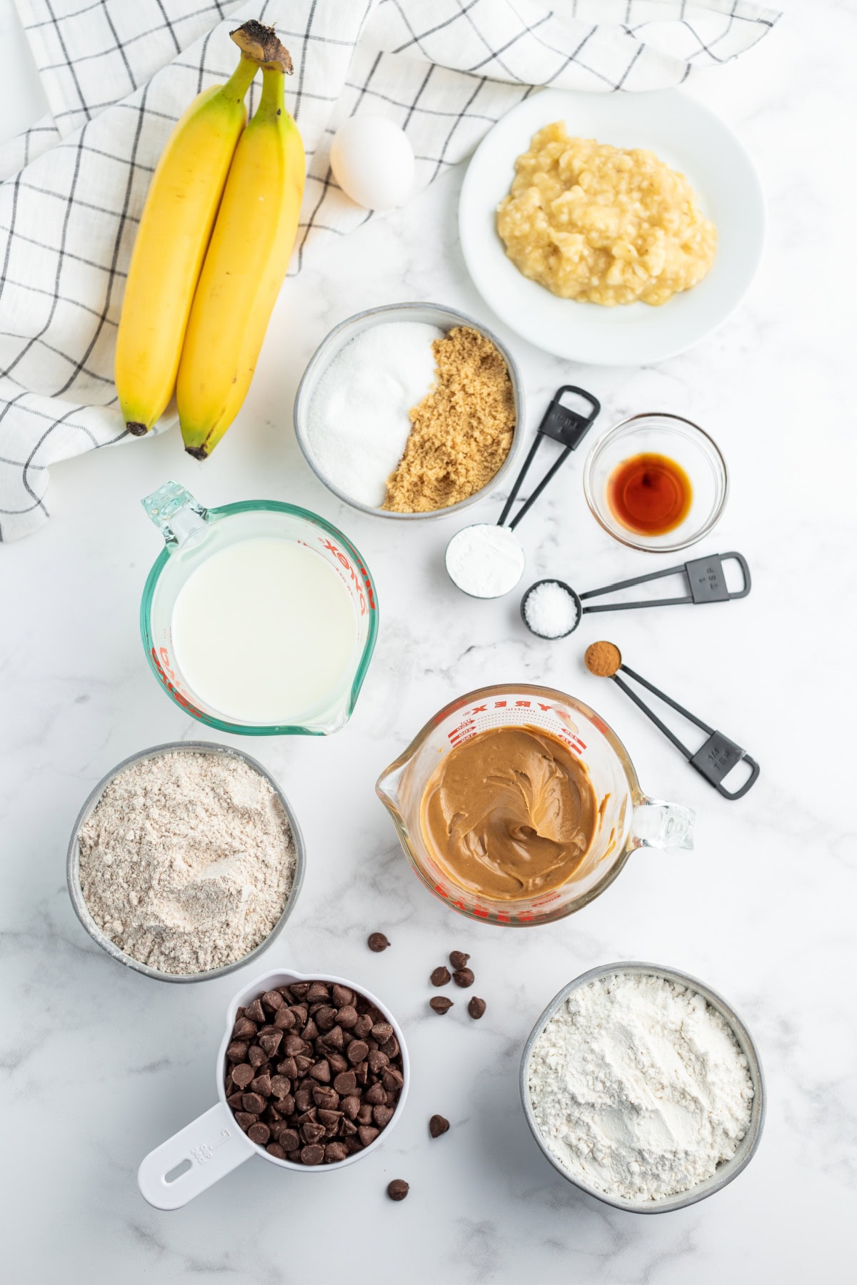 ingredients displayed for making peanut butter chocolate chip banana bread