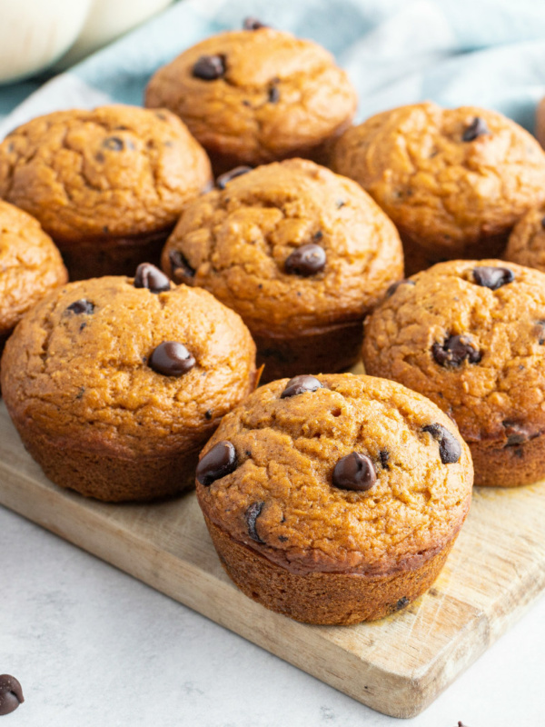 pumpkin chocolate chip muffins on a cutting board