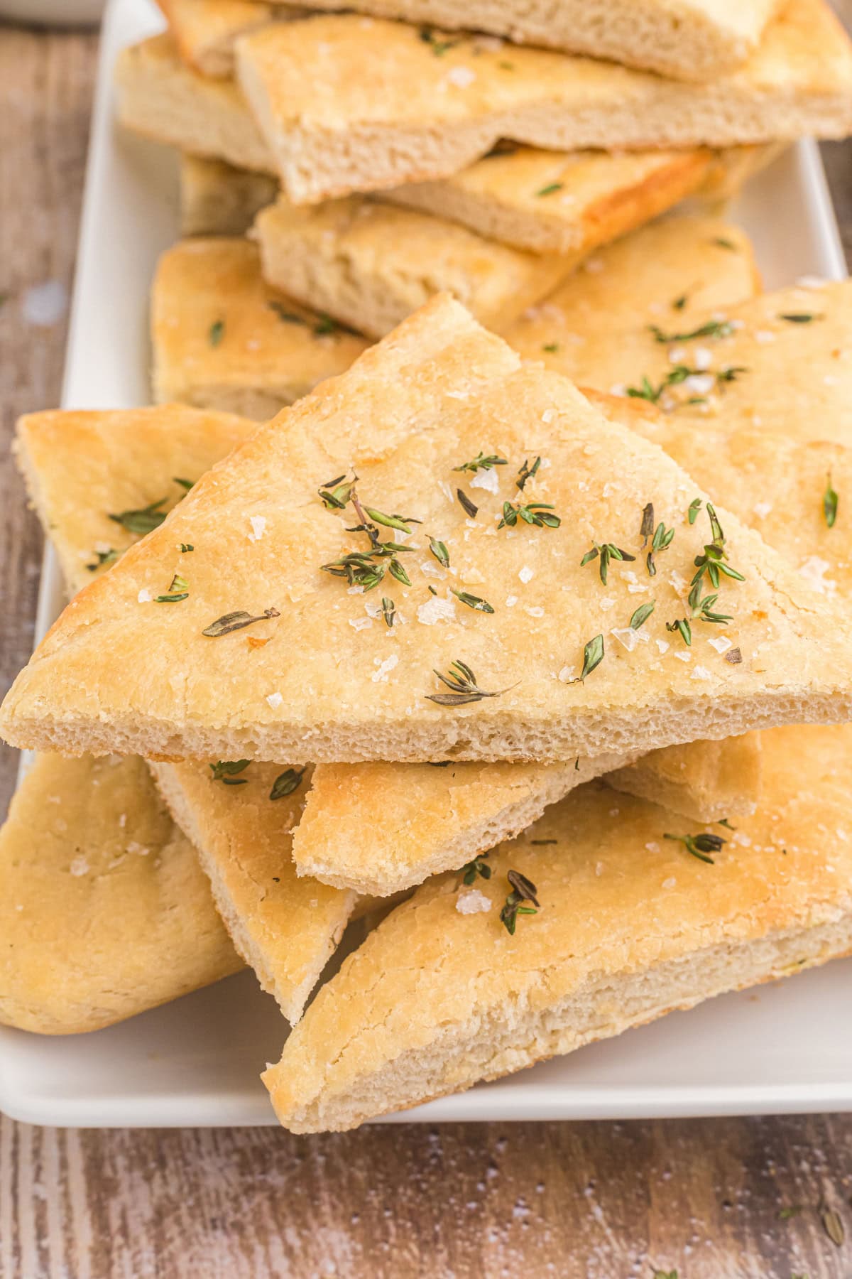 salted thyme flatbread pieces stacked