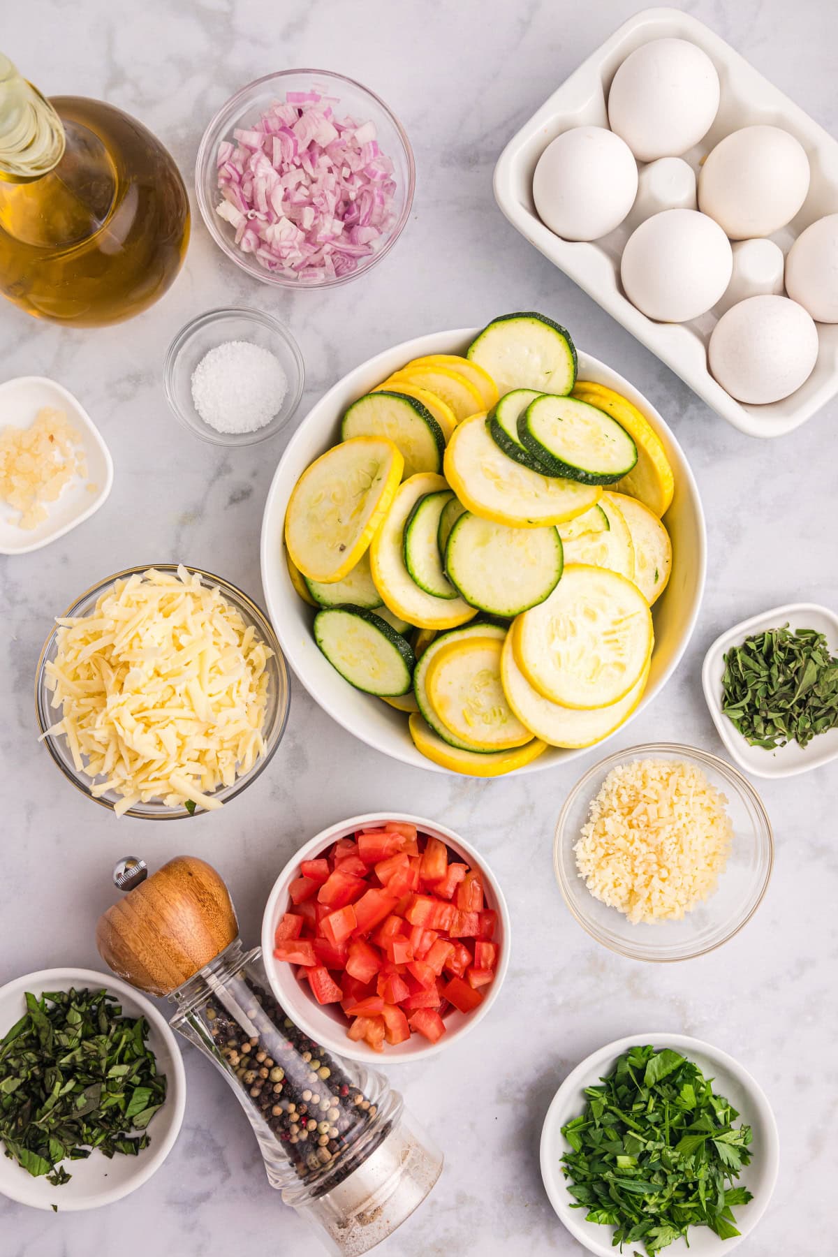 ingredients displayed for making squash and tomato oven frittata