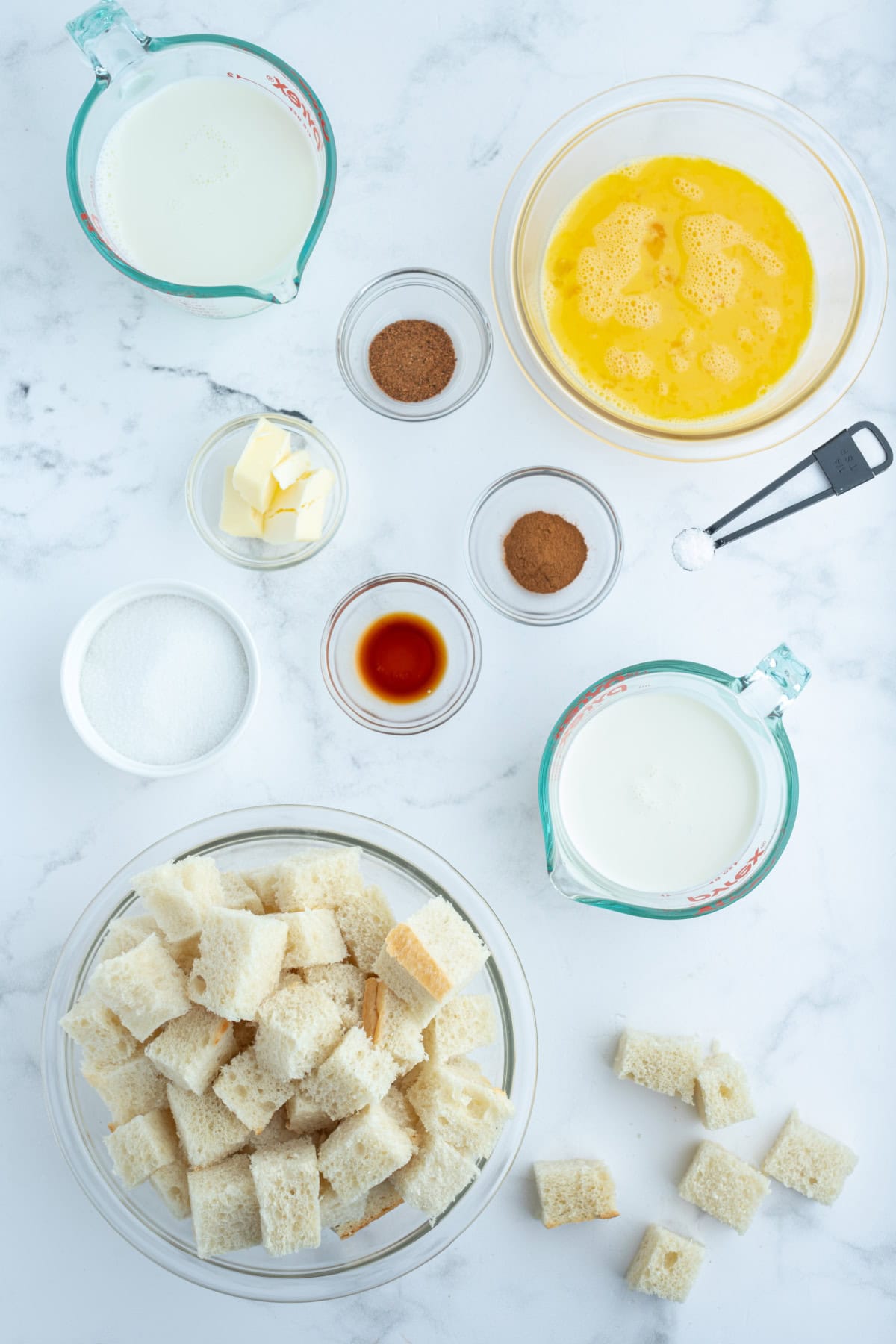 ingredients displayed for making custard bread pudding