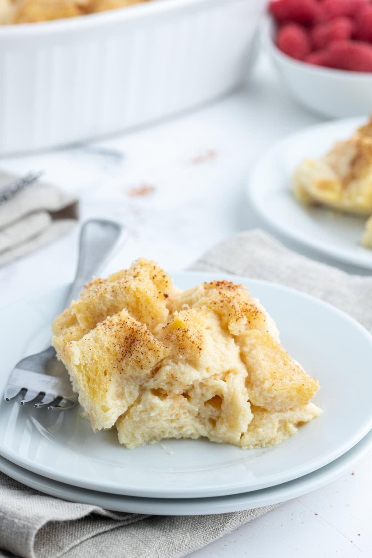 serving of custard bread pudding on plate