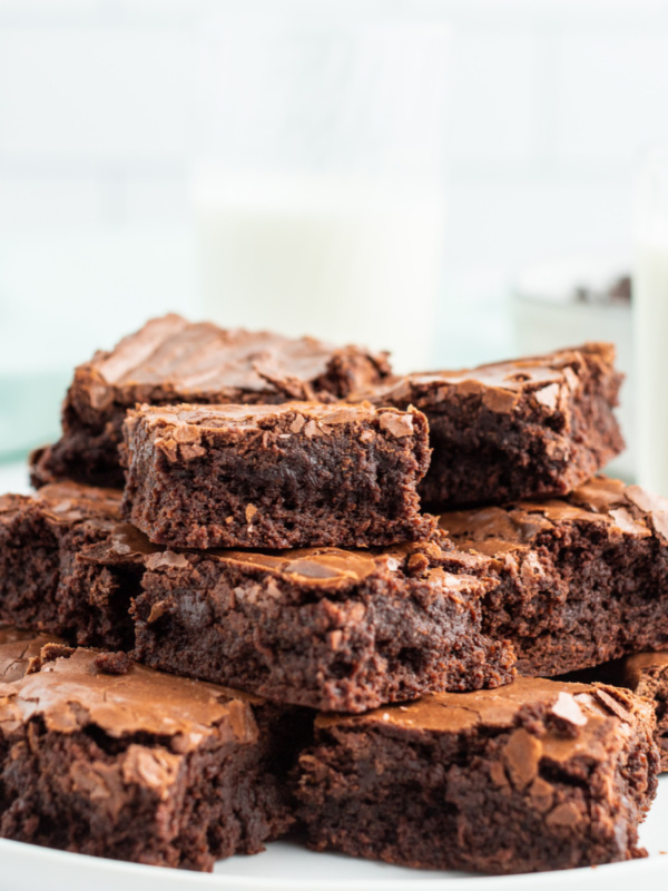 stack of brownies displayed on white platter