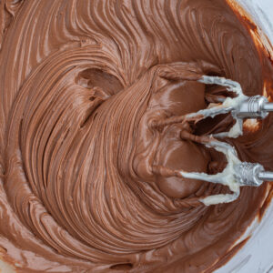 easy chocolate frosting in bowl with beaters