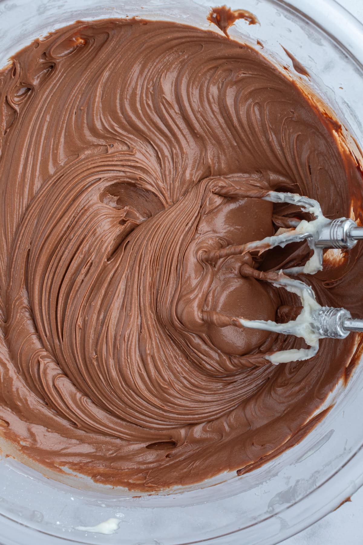 easy chocolate frosting in bowl with beaters