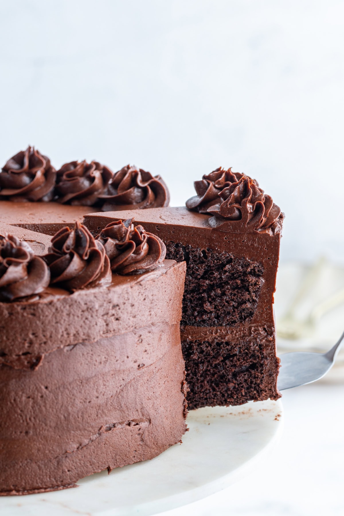 hershey's chocolate cake with slice being taken out of it