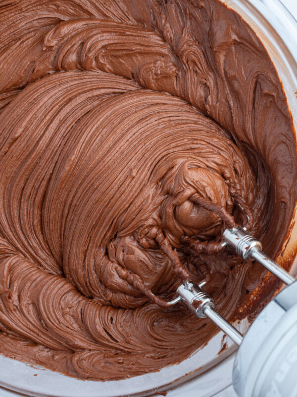 hershey's chocolate frosting in bowl with beaters