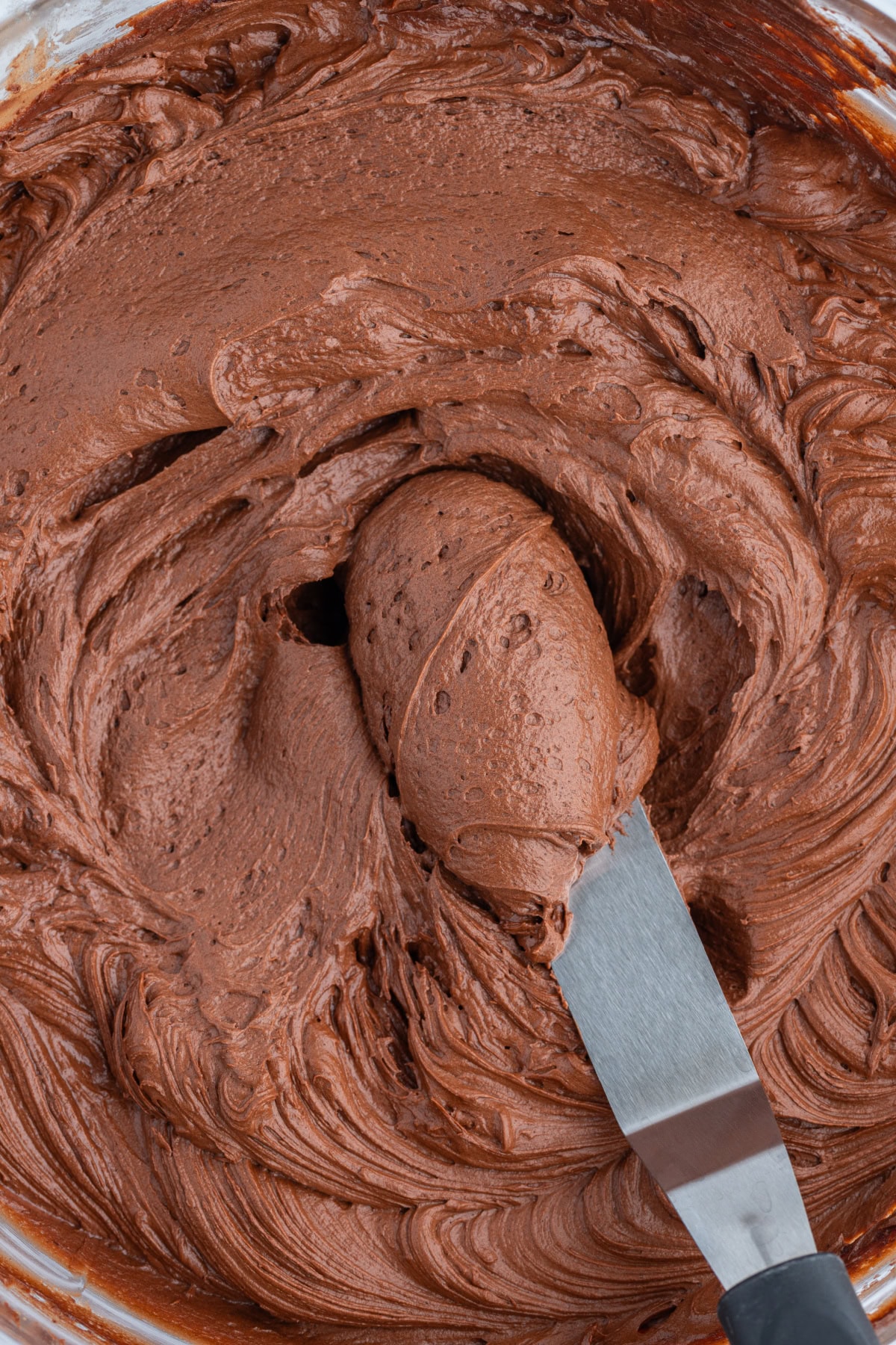 knife in bowl of hershey's chocolate frosting