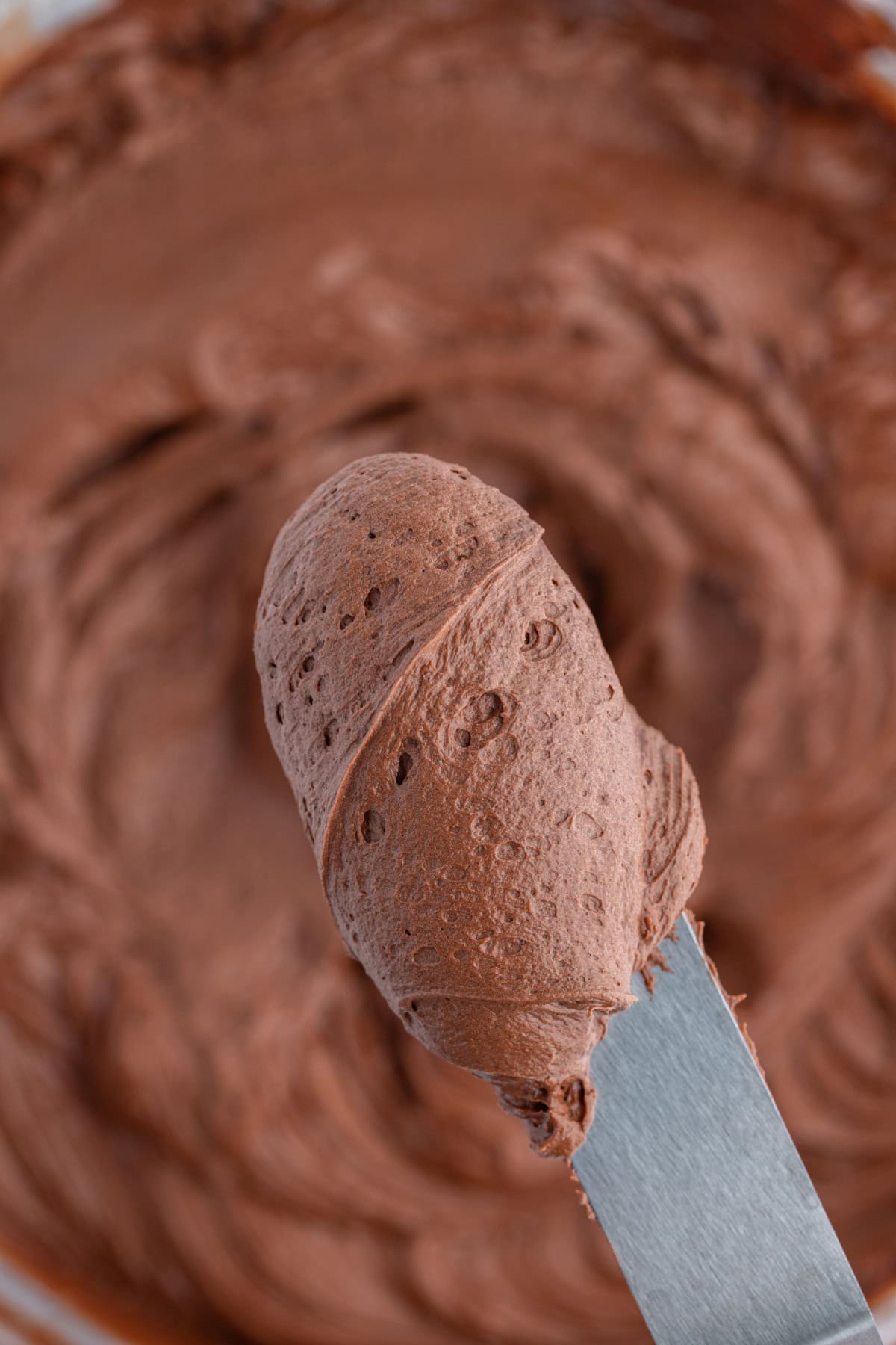 knife in bowl of hershey's chocolate frosting