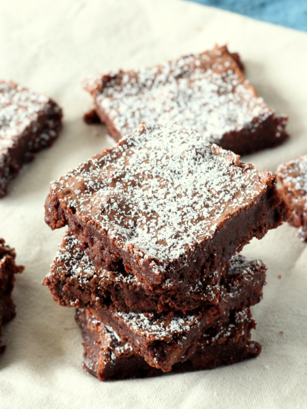 several triple chocolate brownies in a stack