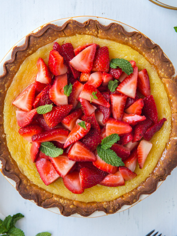 Overhead shot of Strawberry Lemon Buttermilk Pie garnished with fresh mint