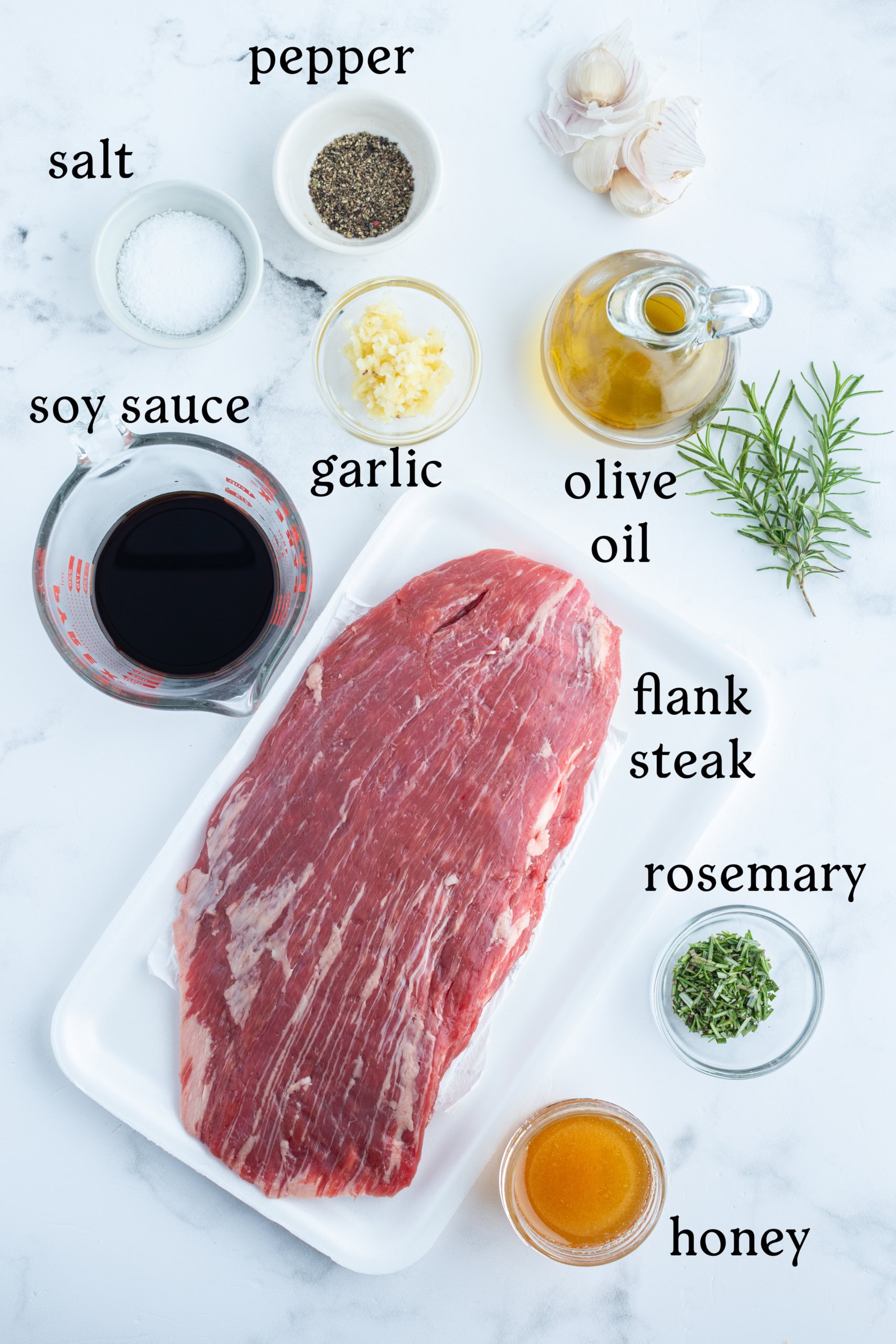 ingredients displayed for making grilled flank steak with rosemary marinade