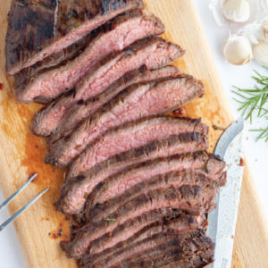pinterest image for grilled flank steak with rosemary marinade