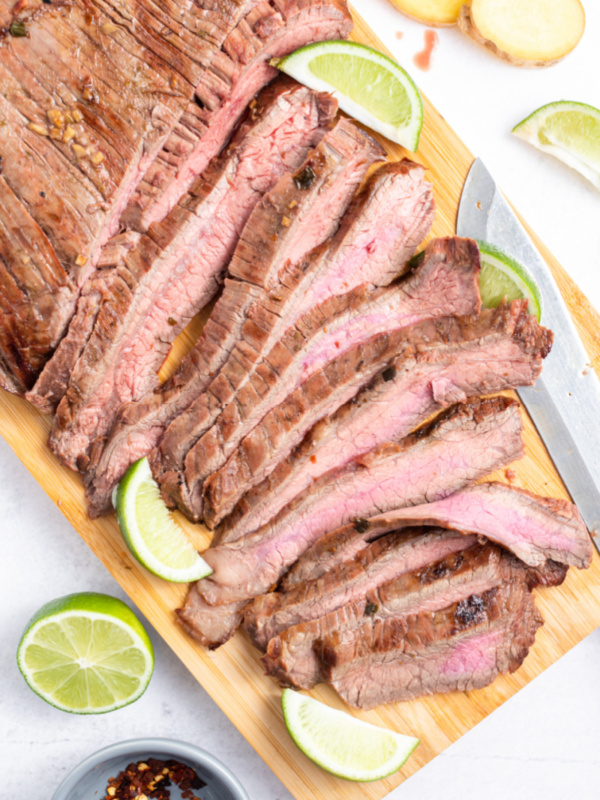 flank steak sliced on a board