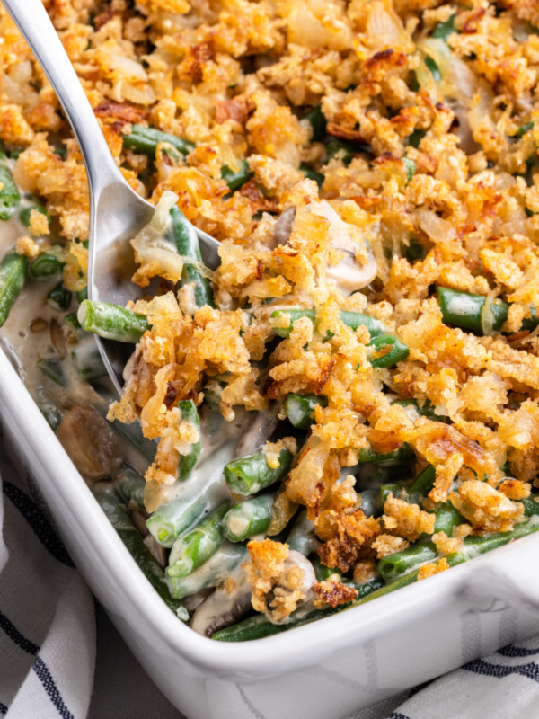 spooning out fresh green bean casserole