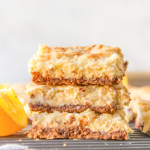 three stacked lemon bars with kit kat crust