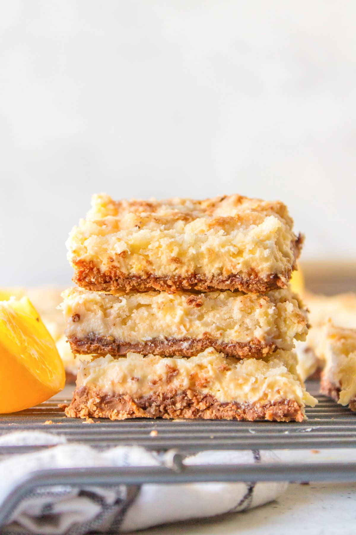 three stacked lemon bars with kit kat crust