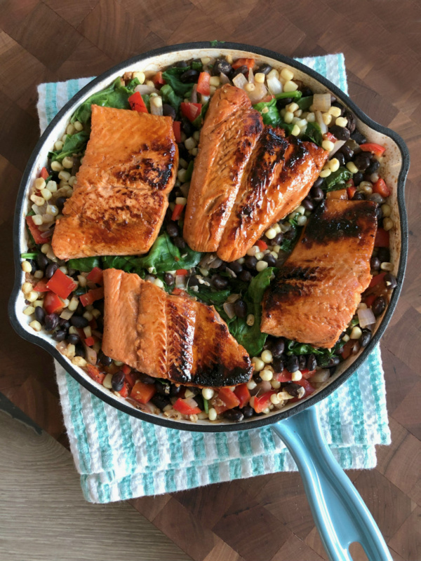 lime and honey glazed salmon in a skillet