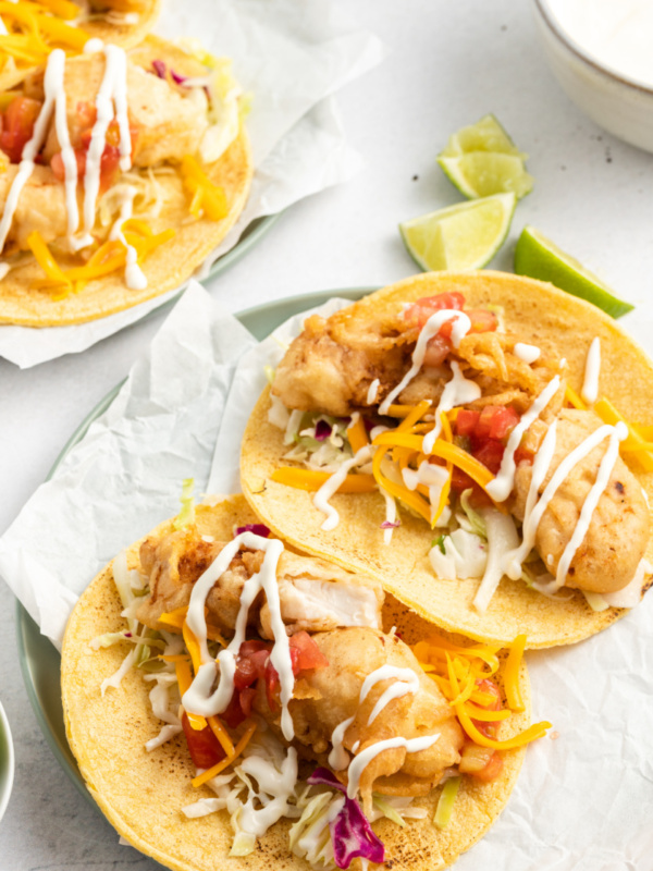 two san diego style fish tacos on a plate