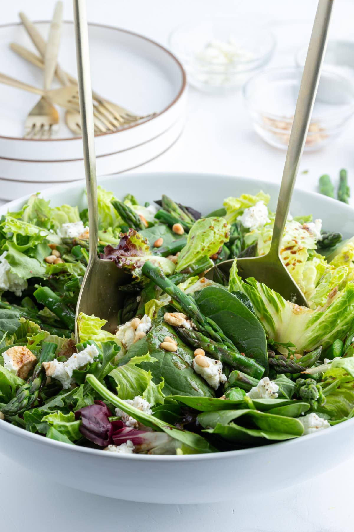 salad tongs in a bowl of salad