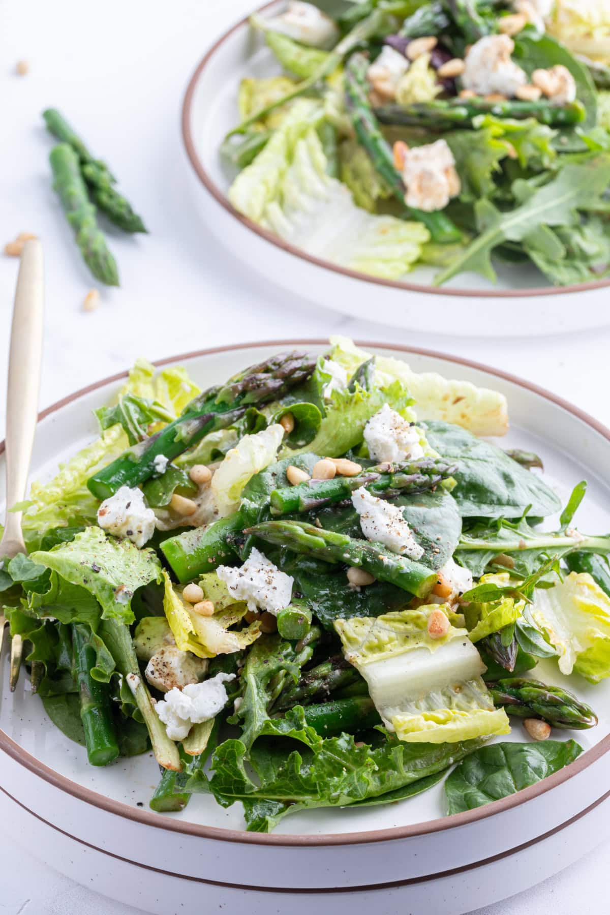 bowls of asparagus and goat cheese salad