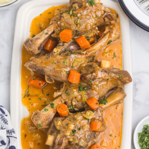 braised lamb shanks on platter