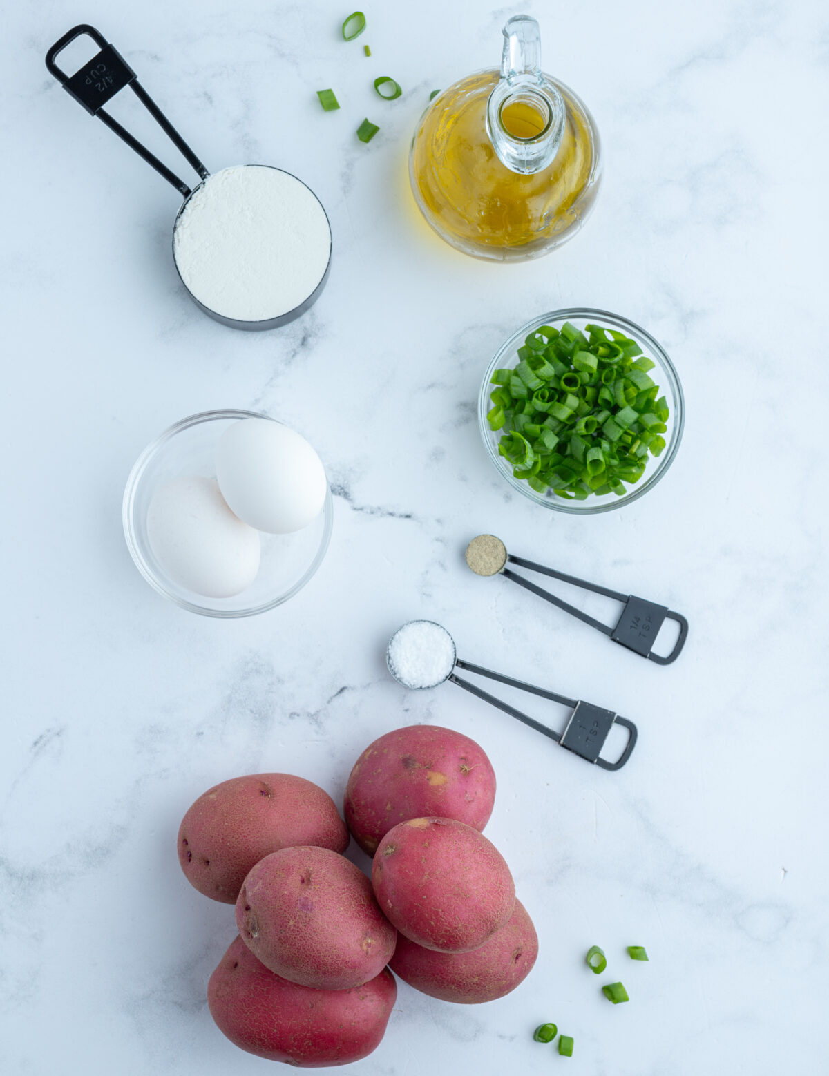 ingredients displayed for making crispy potato pancakes