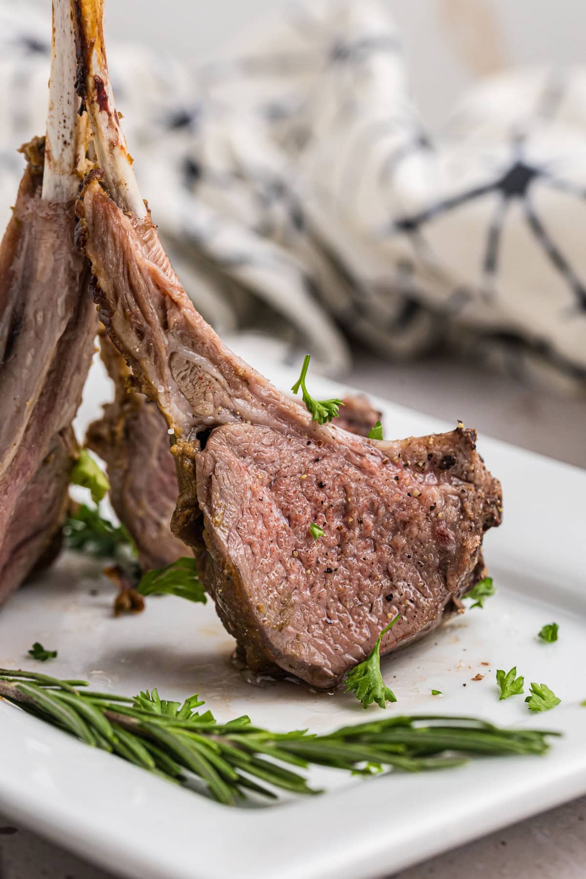 rack of lamb standing up on plate