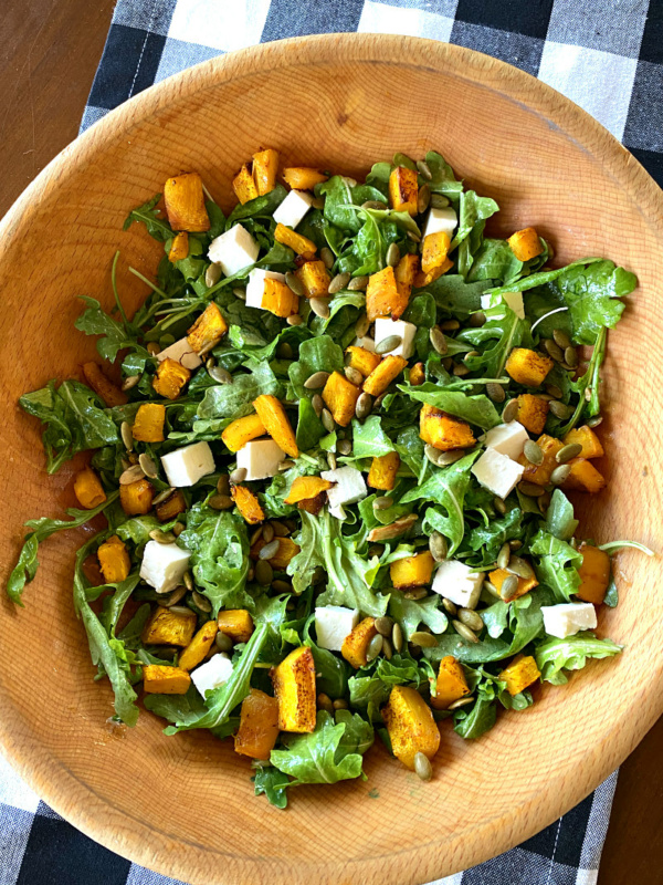 maple roasted pumpkin salad in a wooden bowl