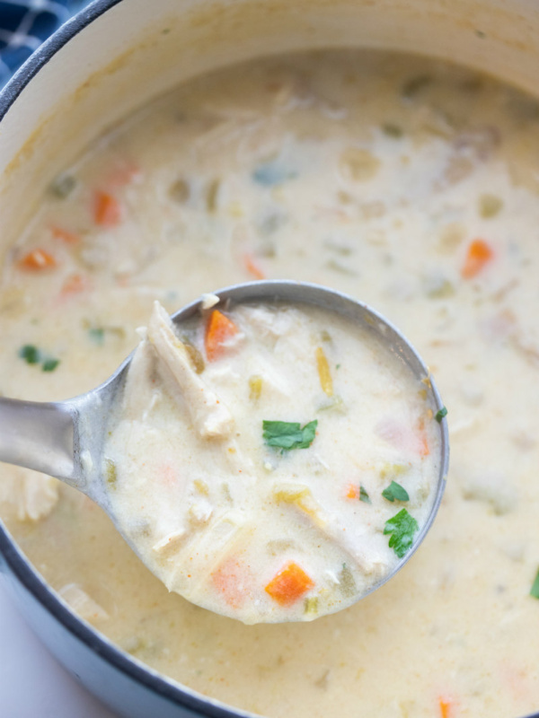 ladle scooping out Mexican turkey soup