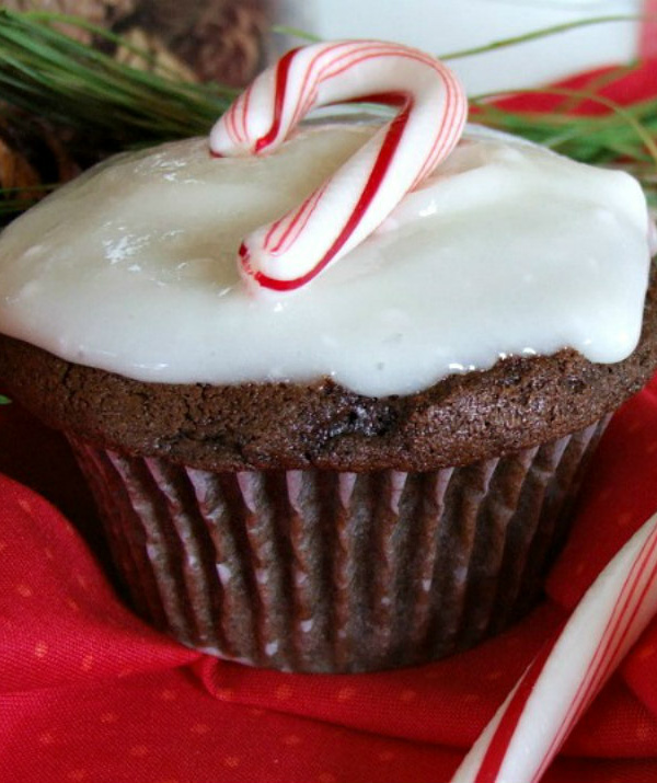 chocolate cupcakes with peppermint icing and a candy cane on top