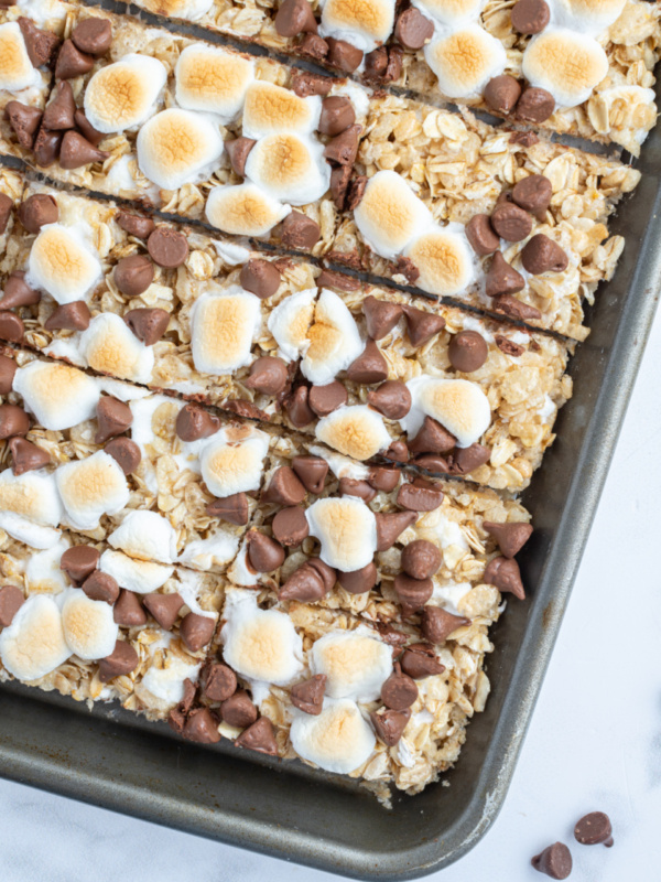 s'mores granola bars on a baking sheet cut into bars