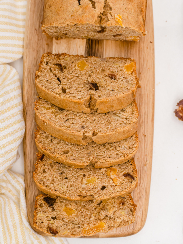 healthy whole wheat banana bread sliced on board