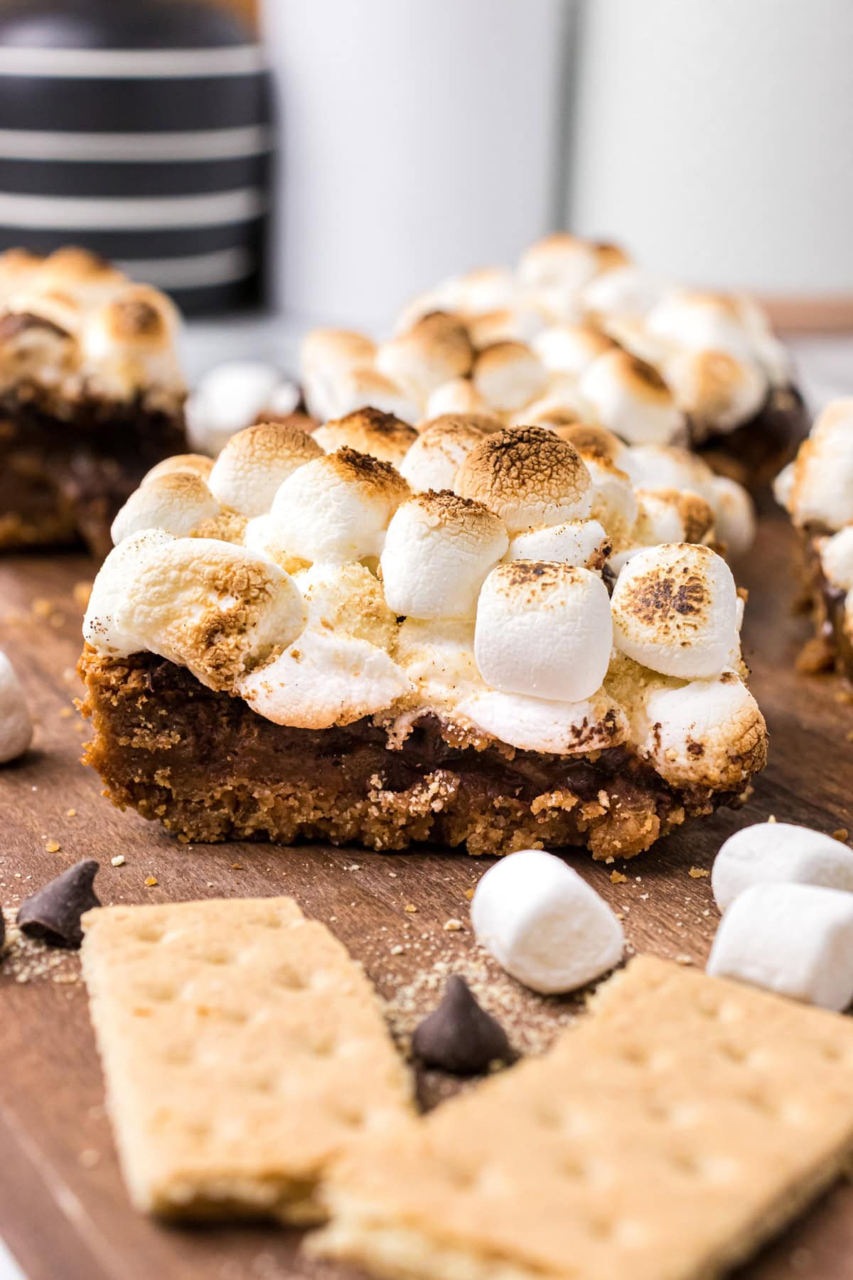 s'mores brownie with graham crackers and marshmallows in background