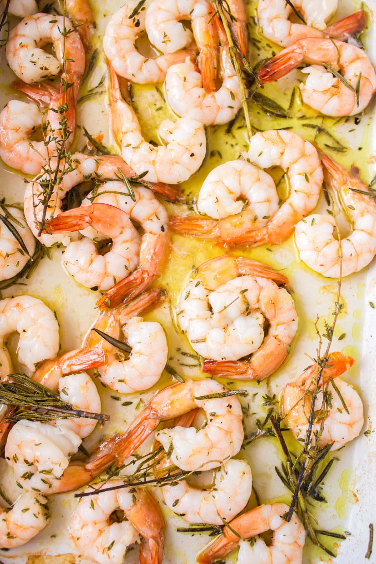 roasted shrimp with rosemary and thyme in a pan