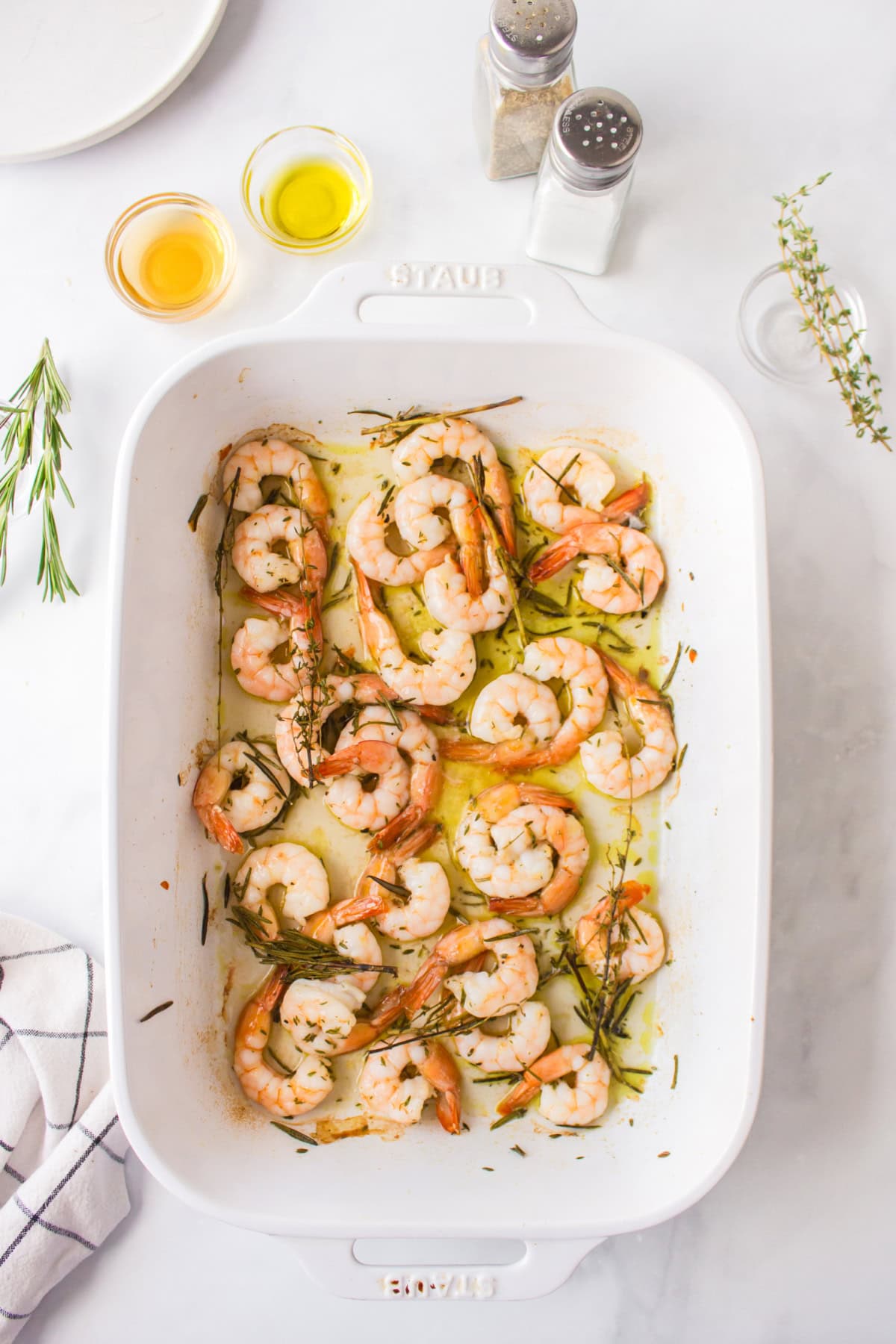 roasted shrimp with rosemary and thyme in baking dish