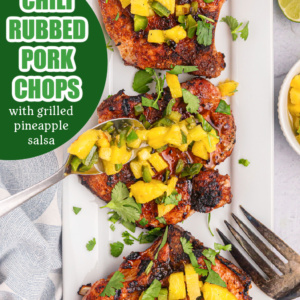 pinterest image for chili rubbed pork chops with grilled pineapple salsa