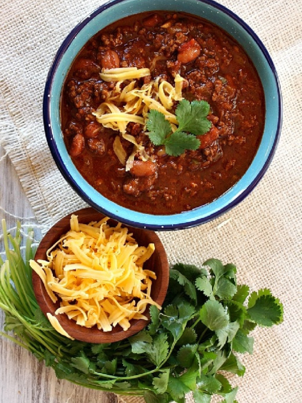 Halftime Chili in a bowl with cheese and cilantro