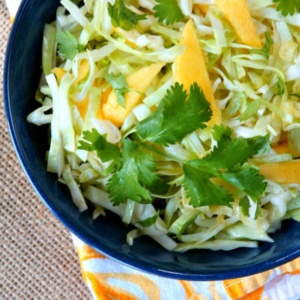 mango slaw in a blue bowl